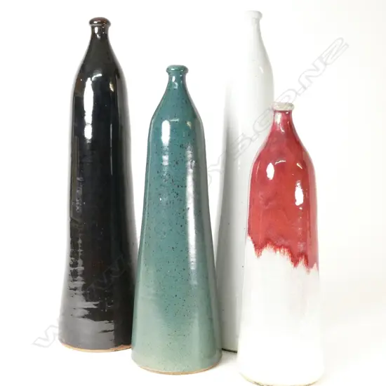 A set of four Nicholas Brandon tall bottles