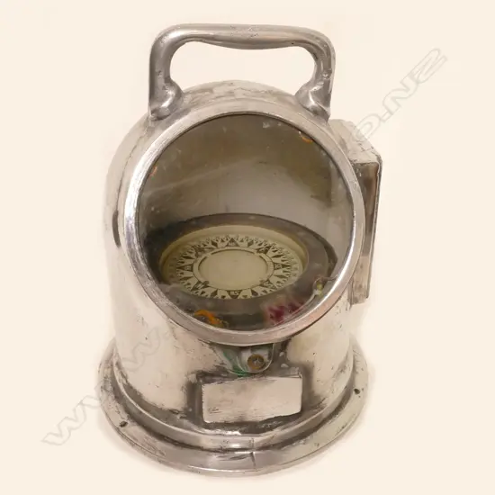 An old silver-plated ship's binnacle compass