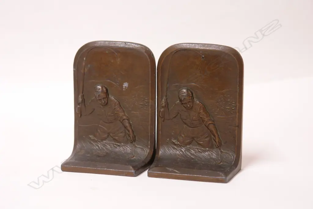 A pair of bronzed spelter heavy fishing themed bookends Image 1++