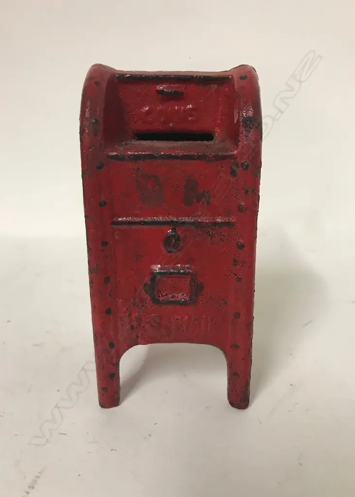 An old cast iron money box Image 1++