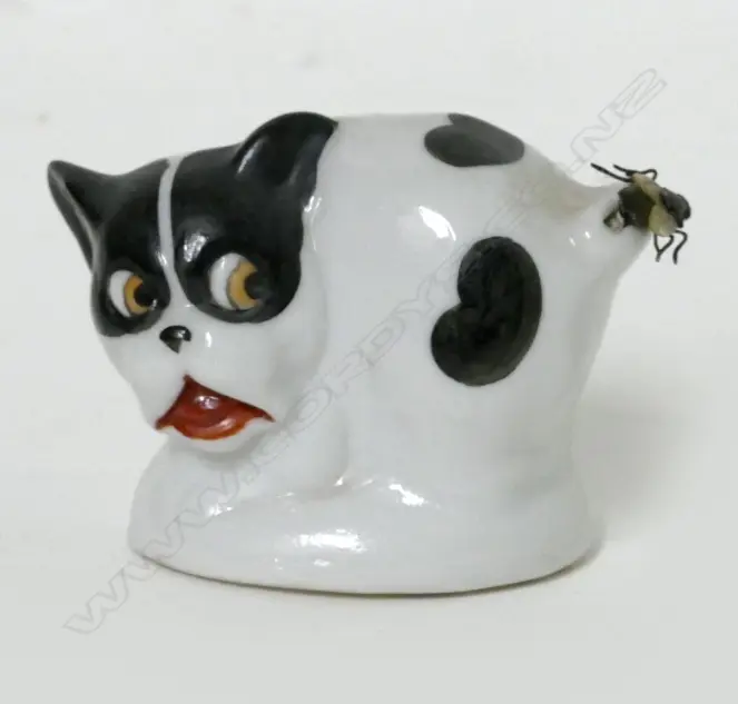 A Victorian novelty china dog with fly tape measure Image 1++