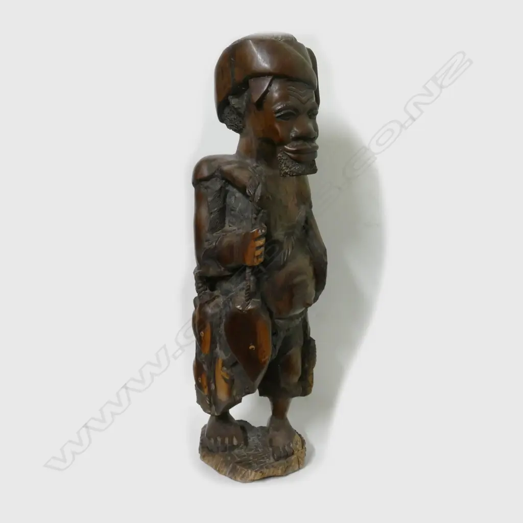 An African heavy carved ebony hardwood sculpture of a fisherman Image 1++