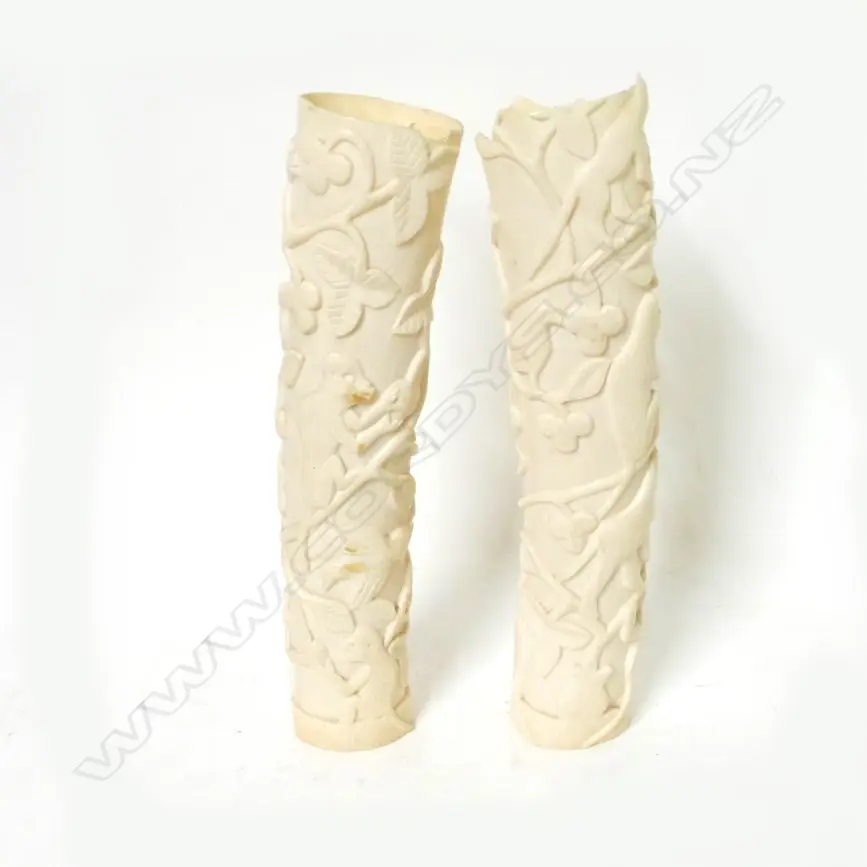 A pair of African carved ivory tusk section vases Image 1++
