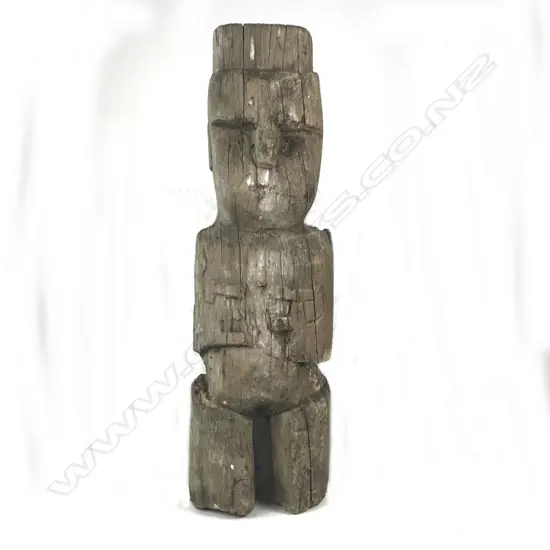 An old Maori carved poutokomanawa figure