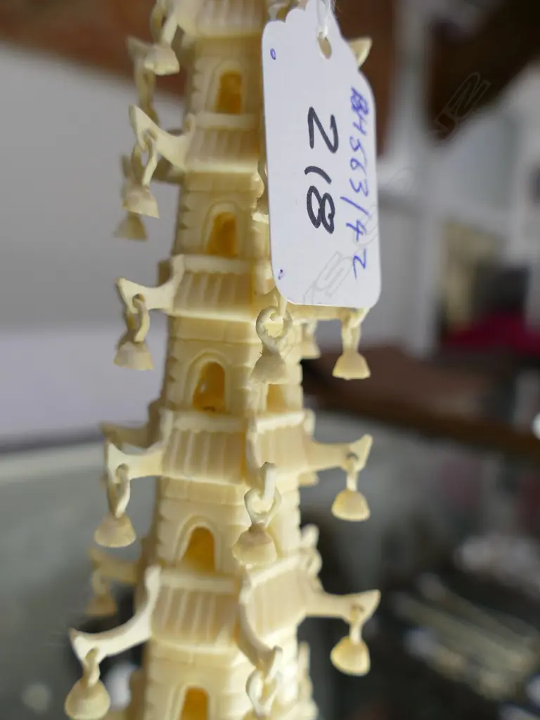 An ivory carving in the form of a tall pagoda Image 1++