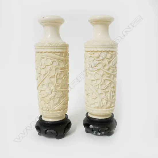 A pair of Chinese carved ivory vases