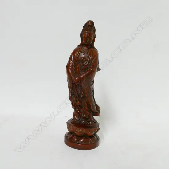 A carved figure of Kuanyin