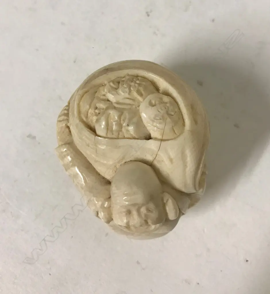 A carved figure of a Hotei Image 1++