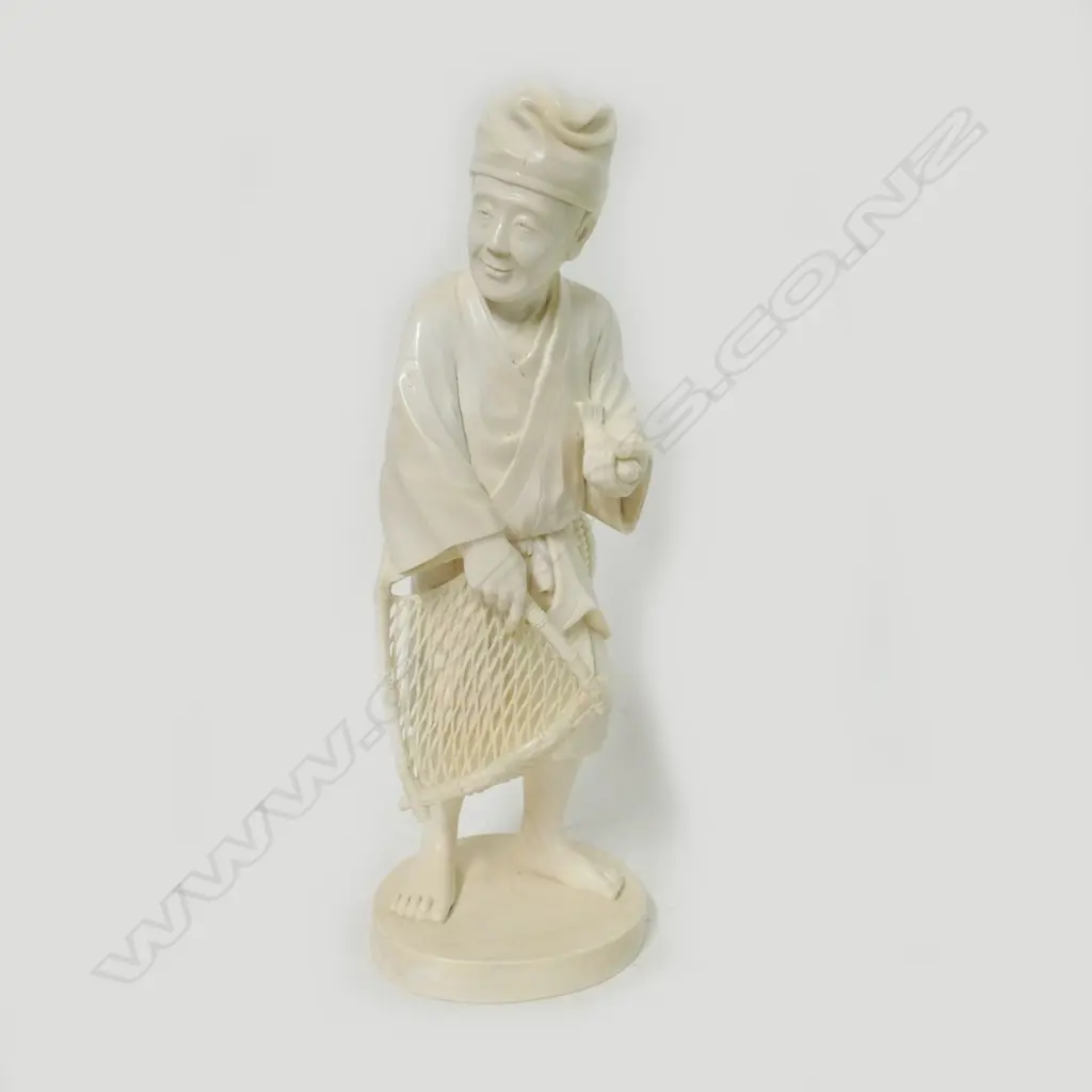 A Japanese carved ivory figure of a fisherman Image 1++