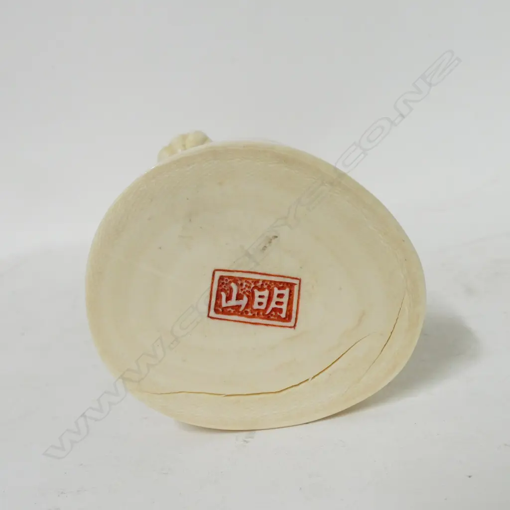 A Japanese carved ivory figure of a fisherman Image 1++