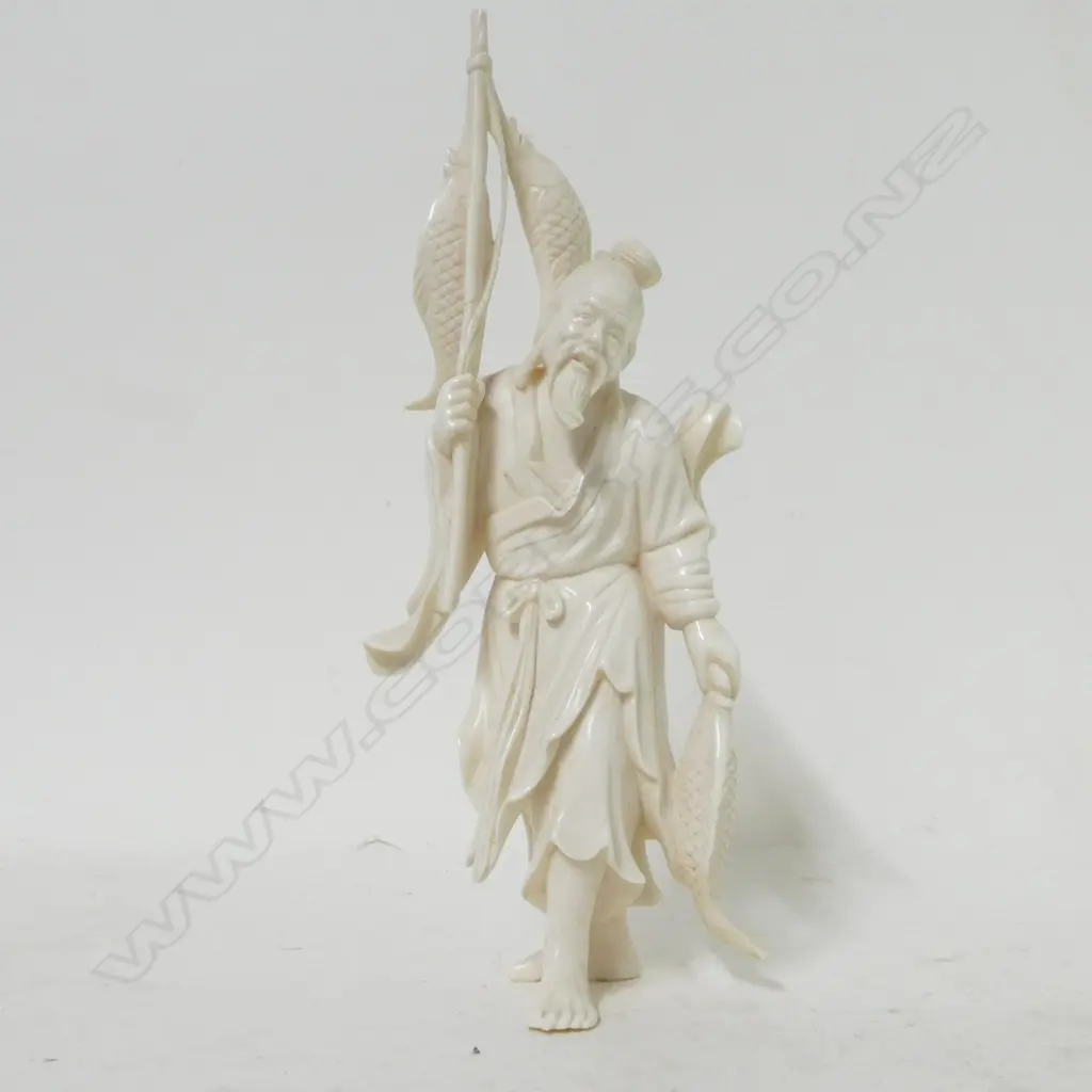 A Japanese ivory carved figure of a fisherman Image 1++