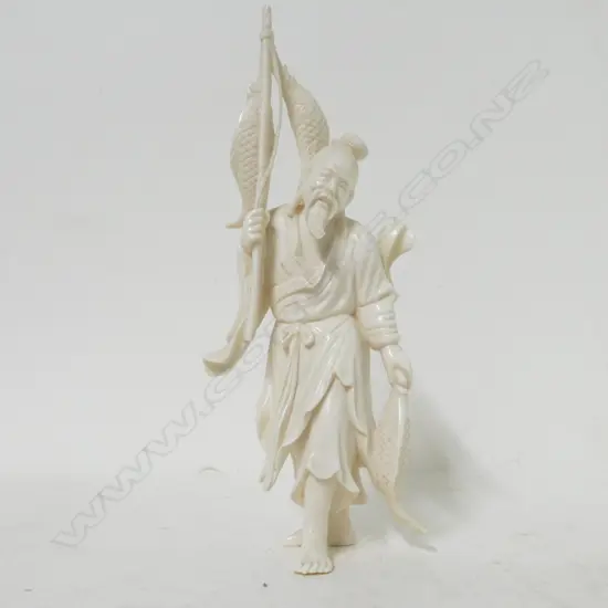 A Japanese ivory carved figure of a fisherman