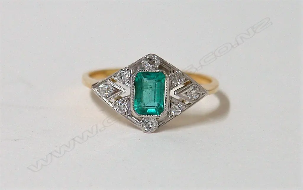 An Art Deco style 18ct. yellow and white gold emerald and diamond lady's ring Image 1++