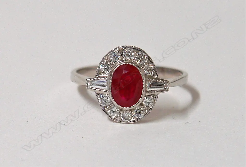 A lady's 18ct. white gold ruby and diamond cluster ring Image 1++