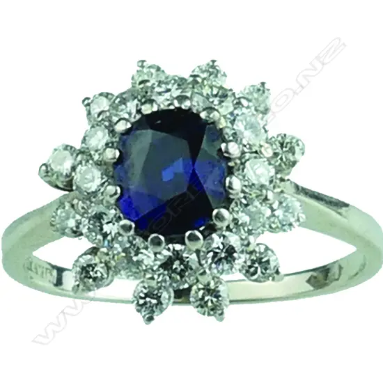 An 18ct. white gold sapphire and diamond cluster ring