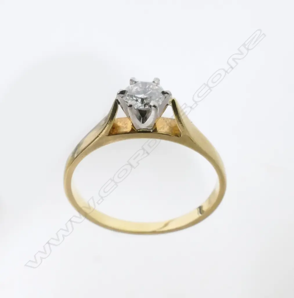 An 18ct. gold solitaire diamond ring Image 1++