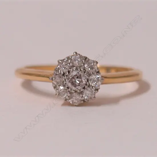 A lady's estate 18ct. yellow gold and diamond cluster ring