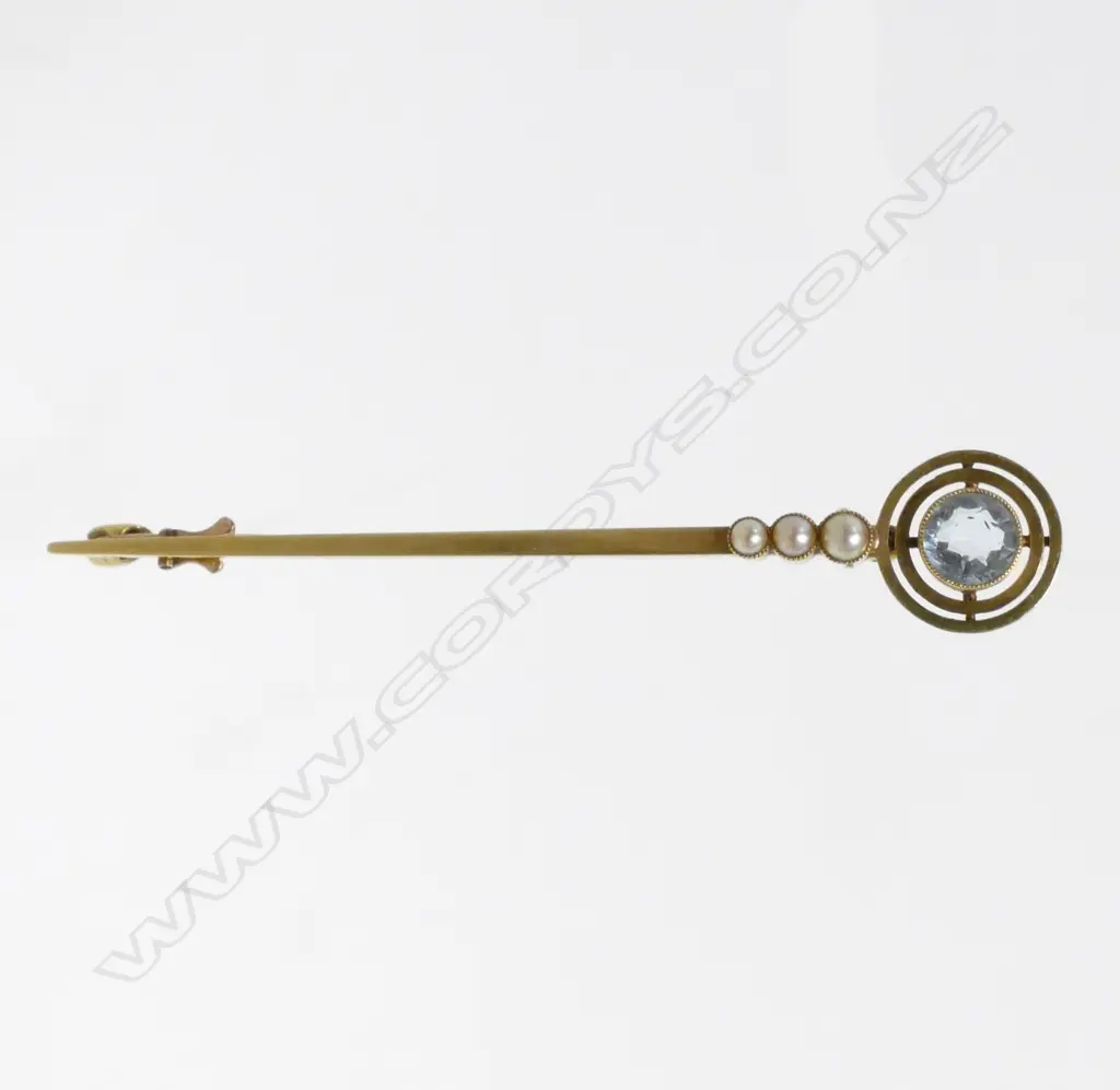 A 15ct. yellow gold aquamarine and seed pearl brooch Image 1++