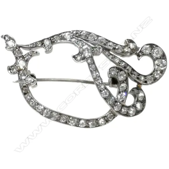 A Victorian 15ct. gold silver and diamond brooch