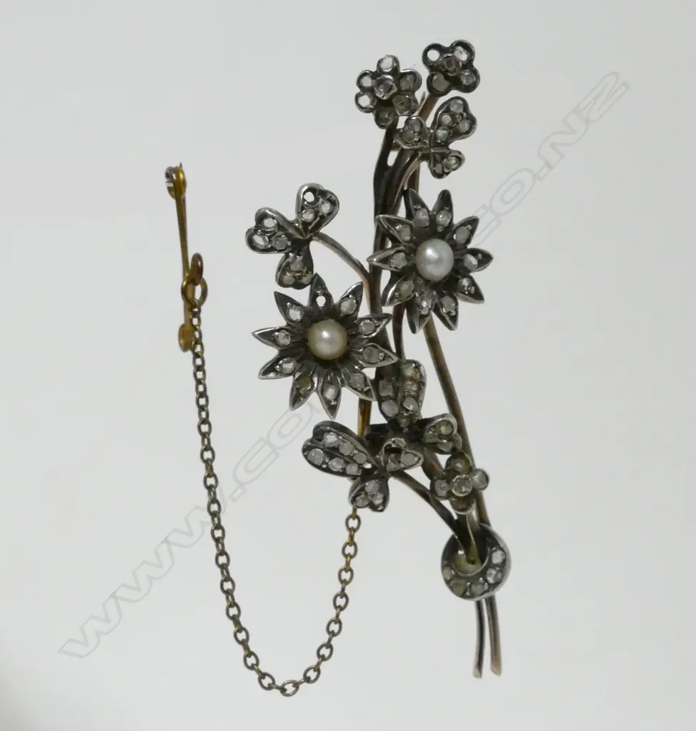 A gold seed pearl and diamond floral brooch Image 1++