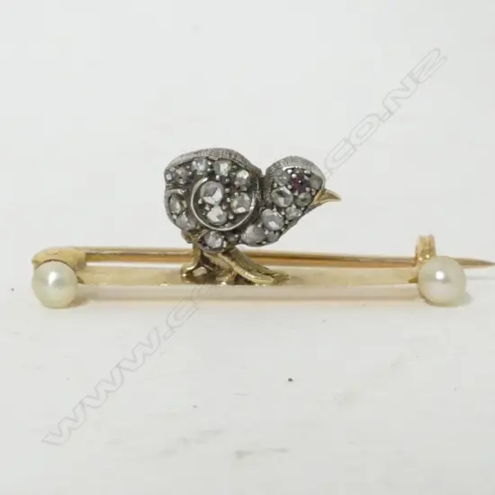 An early 20thC gold diamond and seed pearl chick brooch