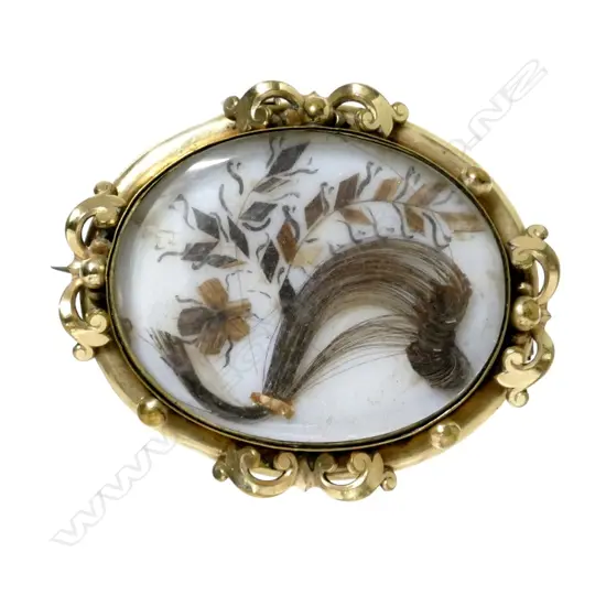 A Victorian large oval mourning brooch