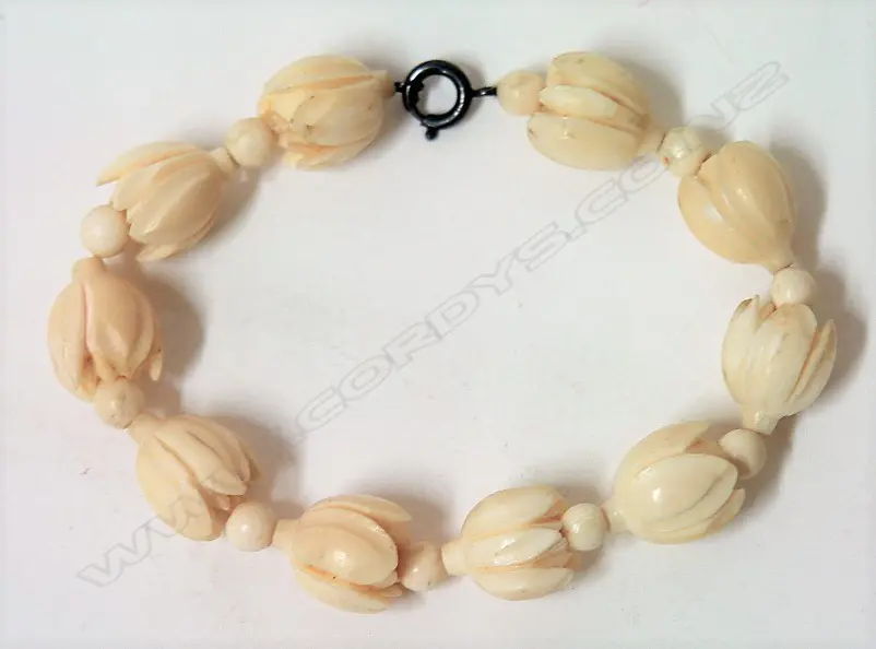 A c.1920 carved ivory bracelet Image 1++