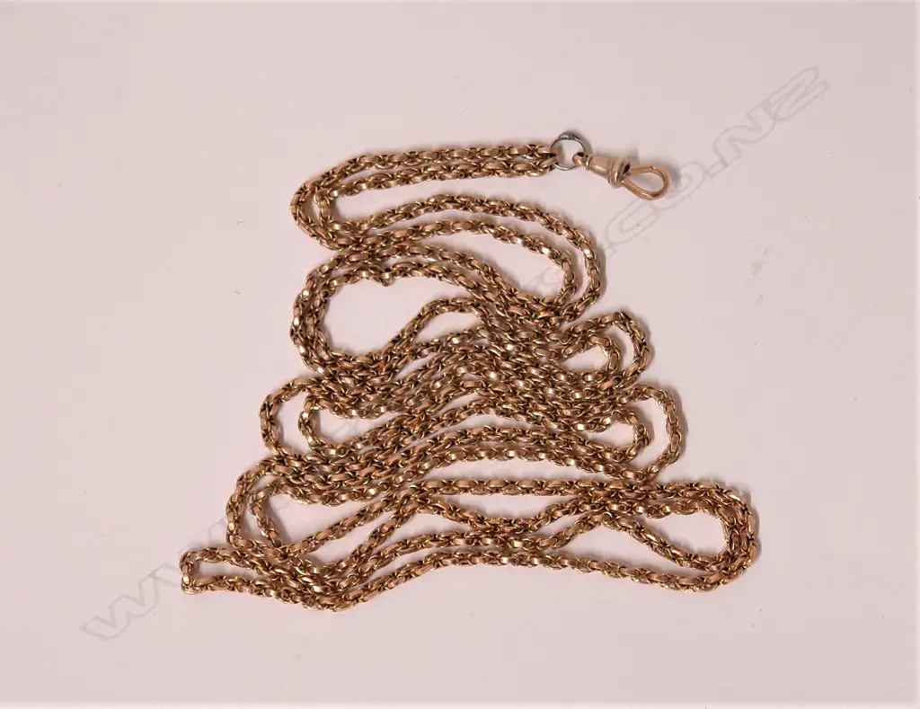 A c.1900 9ct. rose gold muff chain. 33.38gms Image 1++