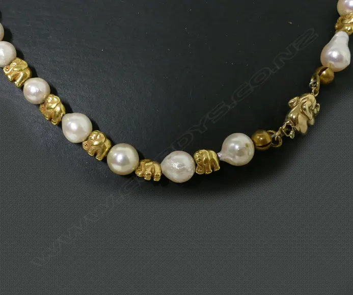 A 14ct. yellow gold and semi-baroque cultured pearl necklace Image 1++