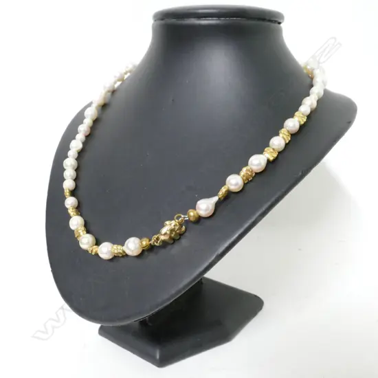A 14ct. yellow gold and semi-baroque cultured pearl necklace