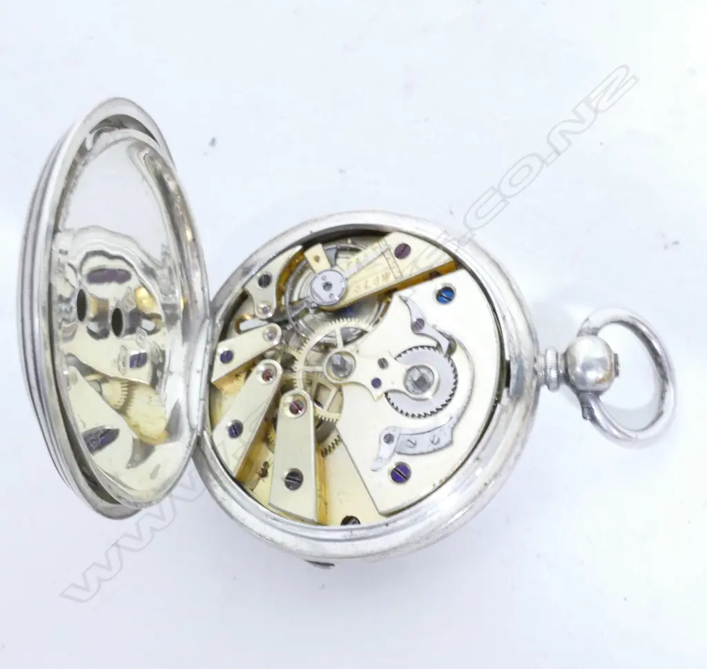A silver pocket watch Image 1++