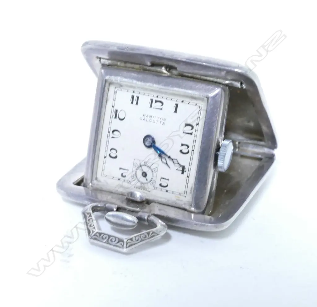 An Art Deco German silver cased miniature travelling clock Image 1++