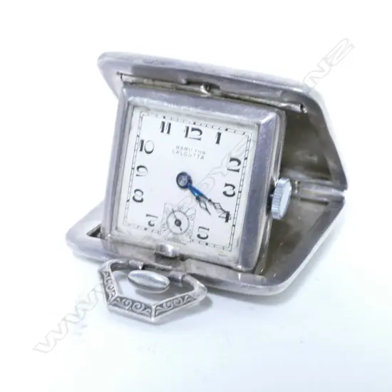 An Art Deco German silver cased miniature travelling clock