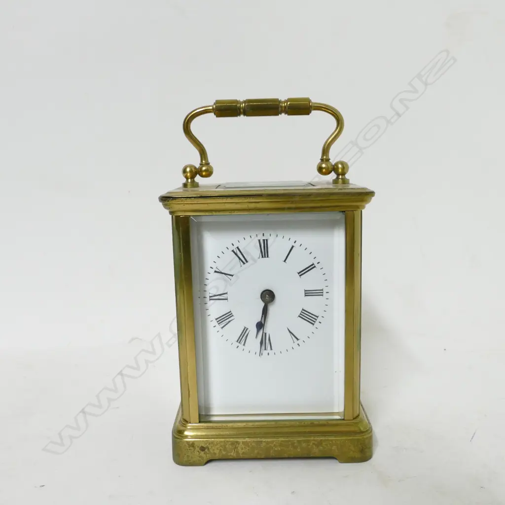 A brass cased carriage clock Image 1++