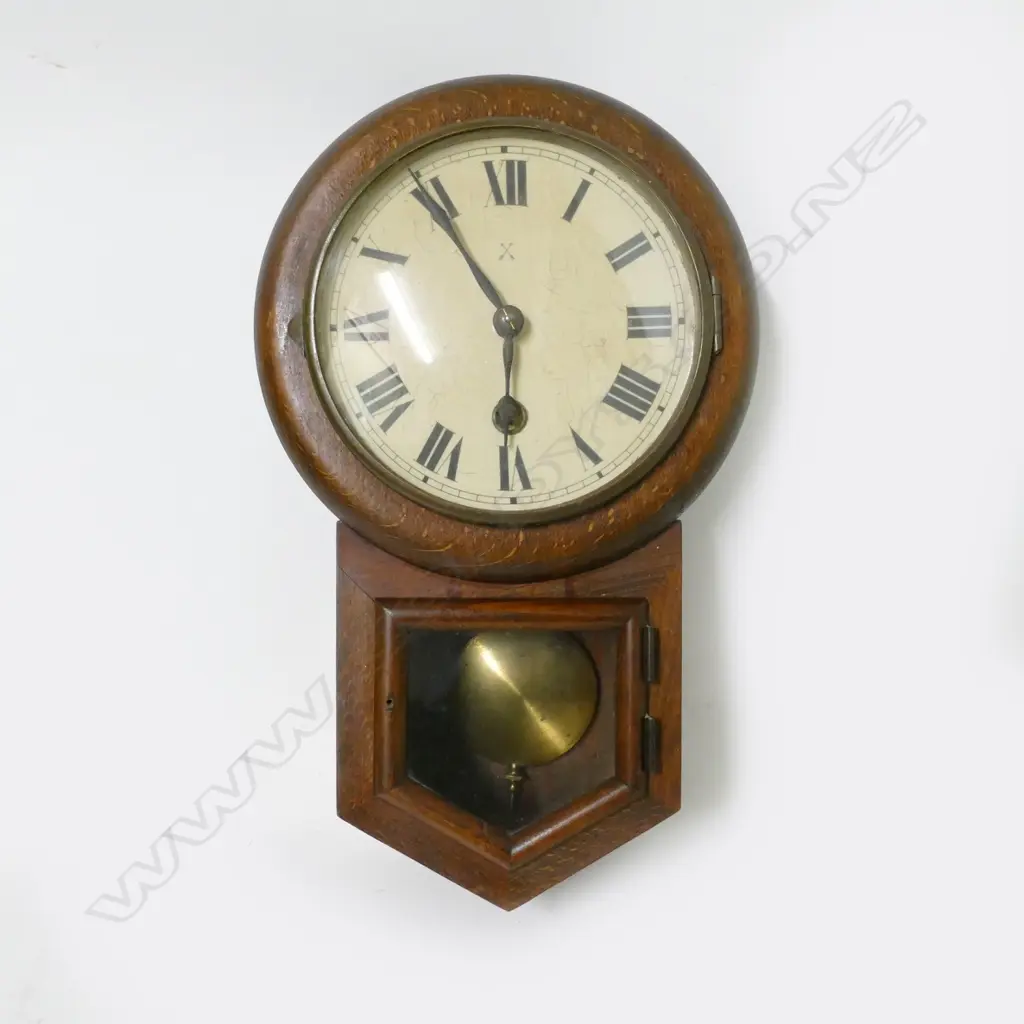A small oak cased drop dial wall clock Image 1++