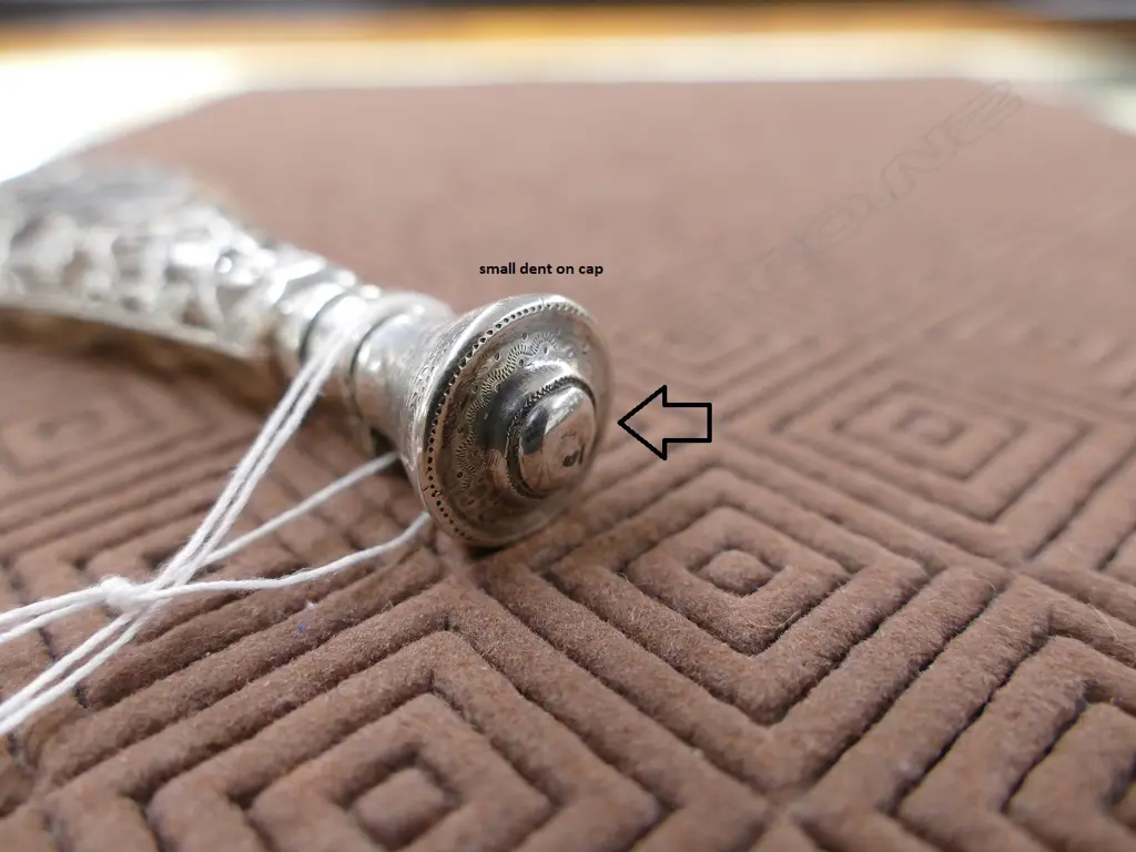 A late 19thC European silver covered glass scent bottle Image 1++