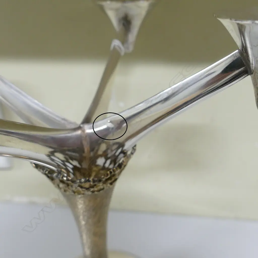 A Stuart Devlin silver and silver gilt four light candelabra Image 1++