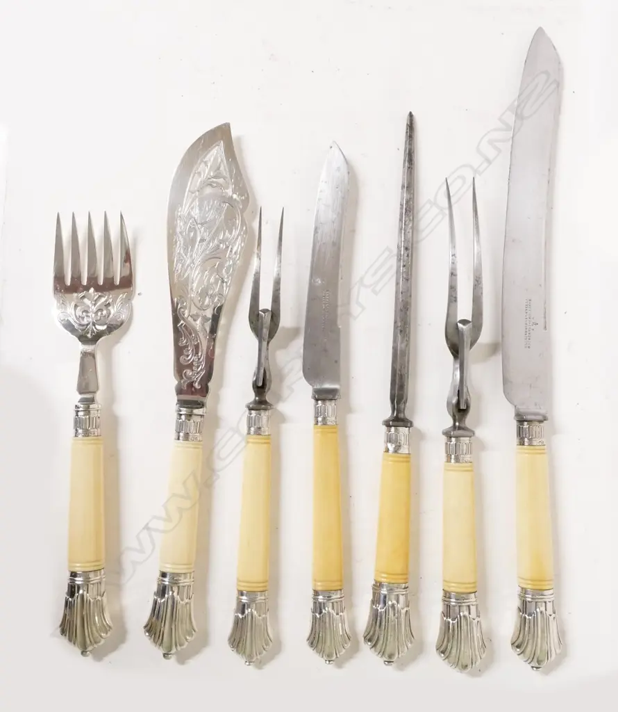 A selection of ivory and silver handled carving and serving utensils Image 1++