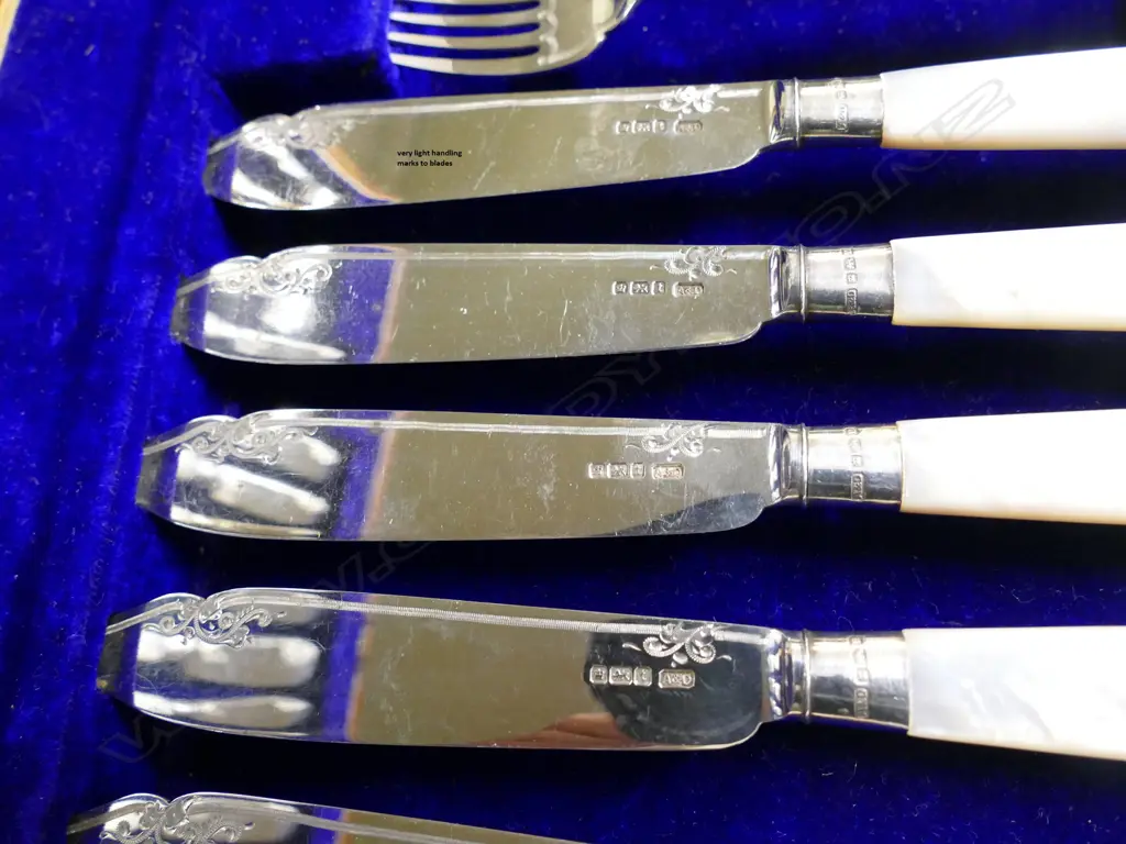 An early 20thC silver and mother-of-pearl 12 place fish service Image 1++