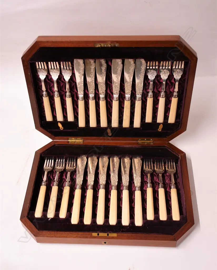 A Victorian silver and ivory handled 12 place fish service canteen Image 1++