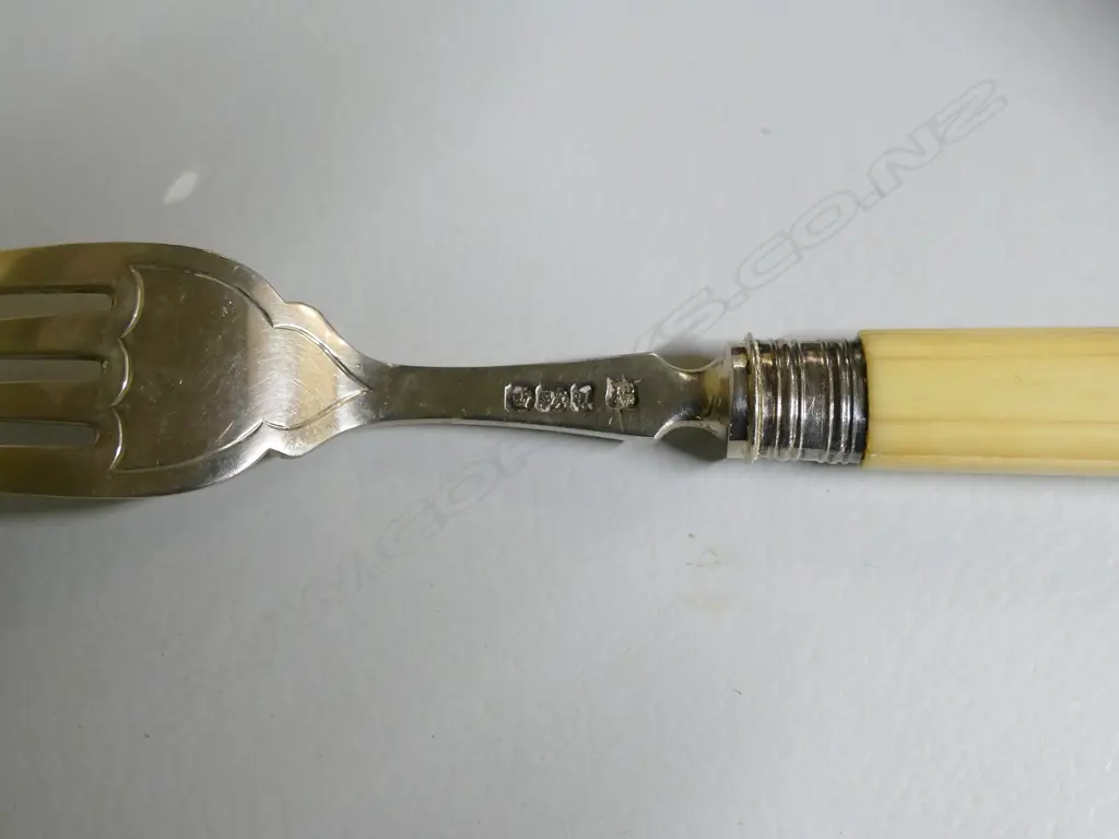 A Victorian silver and ivory handled 12 place fish service canteen Image 1++