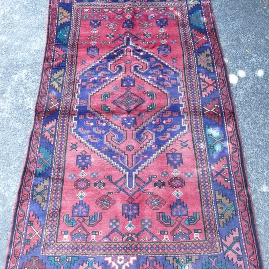 A hand knotted Persian rug