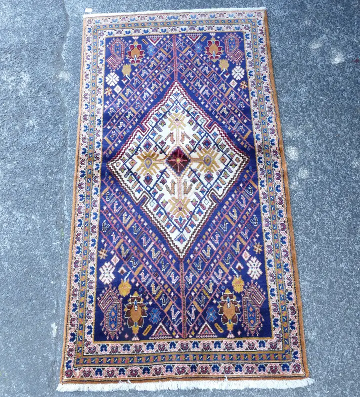 A hand knotted Persian rug Image 1++