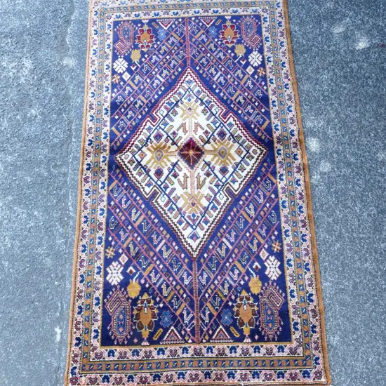 A hand knotted Persian rug