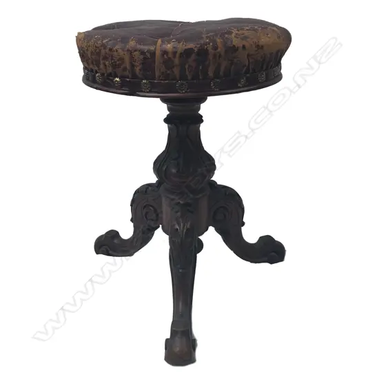 A Victorian revolving piano stool