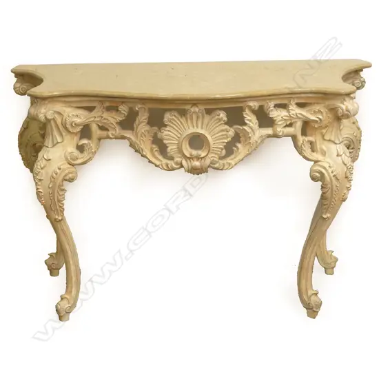 A decorative French style console table with marble top