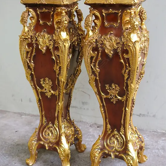 A pair of decorative modern French style torchières with brown faux marble tops