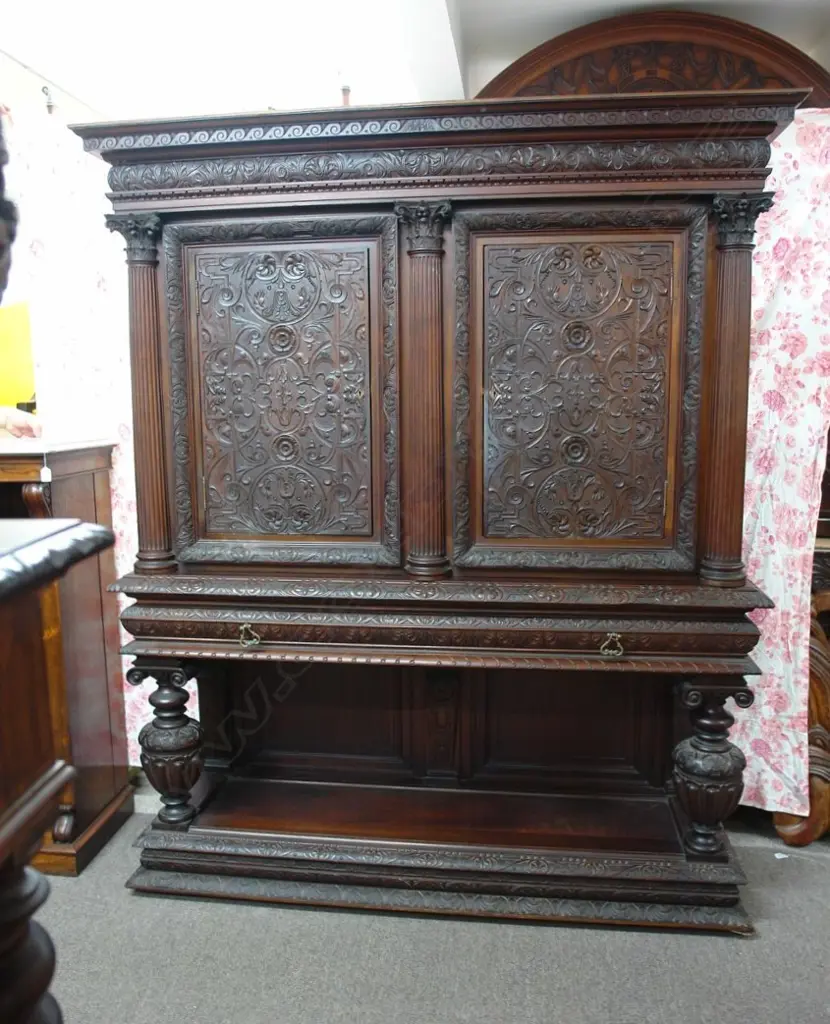 A large ornately carved late 19thC European court cupboard Image 1++