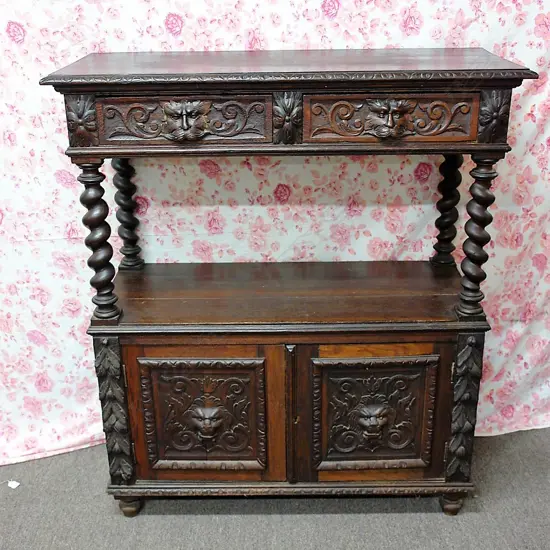 A late 19thC oak carved small court cupboard