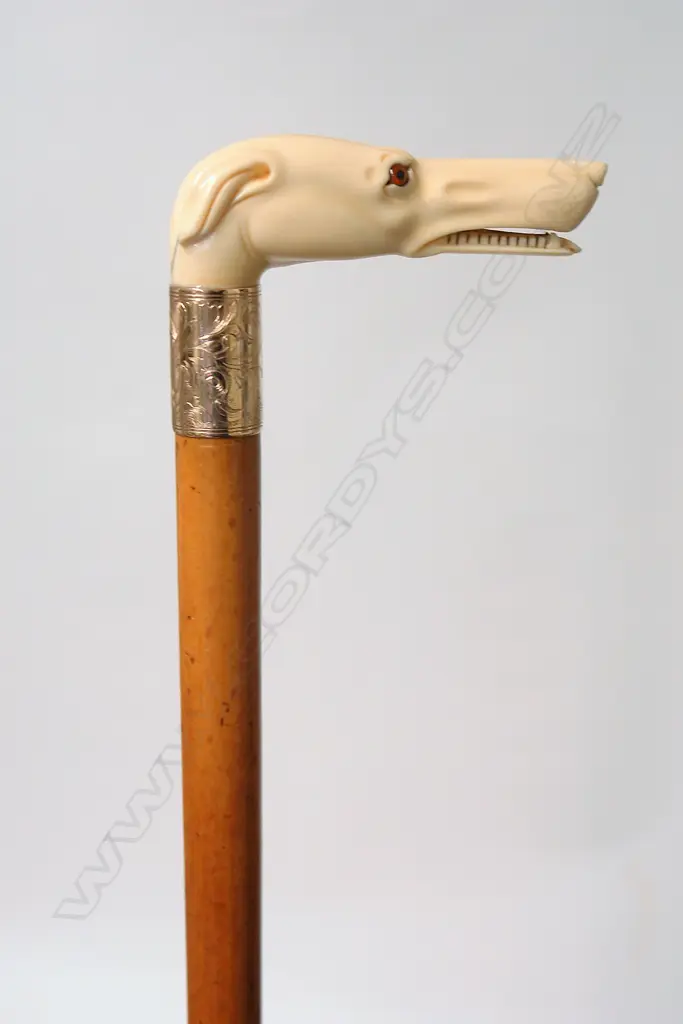 A quality 19thC carved ivory greyhound handled walking stick Image 1++